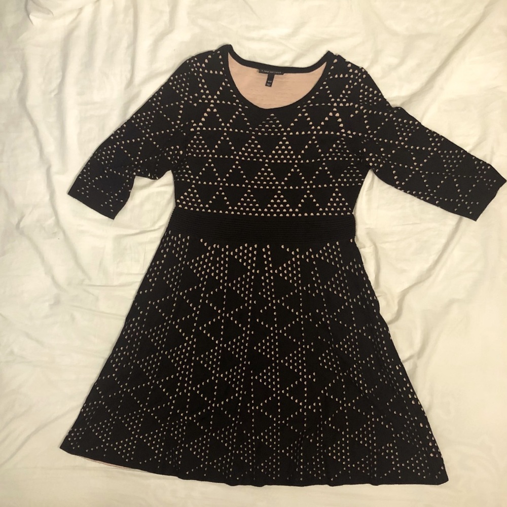 Knee length black dress with light pink accents 3/4 length sleeves lightly used.